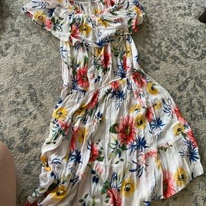 A flower off the shoulder dress